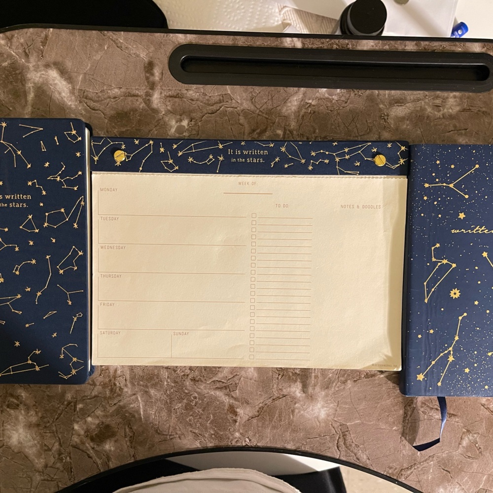 It is written in the stars undated calendar and two notebooks.
